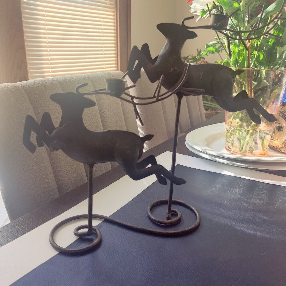Candleholders of Leaping & Flying Reindeer just as you would expect at Christmas